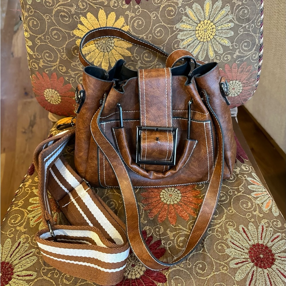 Cute leather brown purse given as a gift.  It has never been used.